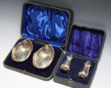 A CASED SET OF HALLMARKED SILVER PIERCED DISHES - SHEFFIELD 1915, together with a cased pair of