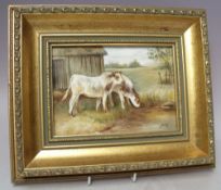 A HAND PAINTED CERAMIC PLAQUE BY JAMES SKERRETT, depicting cattle before a barn, landscape on the