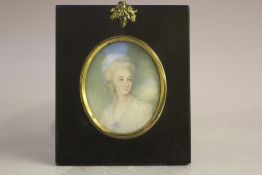 (XIX). British school oval portrait miniature on ivory of a young woman in white dress, landscape