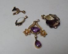 A COLLECTION OF YELLOW METAL AND GOLD GEMSET PENDANTS, to include a 9ct gold opal and sapphire