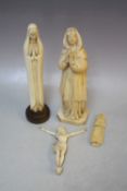 A COLLECTION OF FOUR ASSORTED CARVED IVORY FIGURES, to include a Corpus Christi, nun, etc. (4)