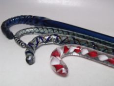 A COLLECTION OF NAILSEA GLASS WALKING CANES, together with a blue glass example of square form,