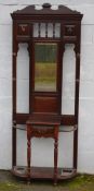 A LARGE EDWARDIAN MAHOGANY MIRRORED HALL STAND, with brass fittings, single small drawer, the base