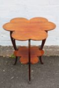 A LATE 19TH / EARLY 20TH CENTURY SHAMROCK SHAPED TWO TIER OCCASIONAL TABLE, numbered 144 to base,