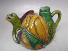 AN UNUSUAL SMALL MAJOLICA TEAPOT, the spout in the form of a mythical winged beast, W 15.5 cm S/D