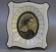 (XX). An oval portrait miniature on ivorine of a young woman, indistinctly signed middle right,