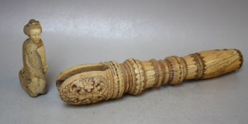 AN EASTERN CARVED IVORY HANDLE / PULL?, with incised decoration around the turned body, with cut-