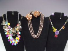 A SELECTION OF BUTLER AND WILSON FASHION JEWELLERY, to include a faux pearl and faceted glass flower