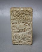 A 19TH CENTURY CHINESE CANTON CARVED IVORY SMALLER CARD CASE, typically decorated with figures and
