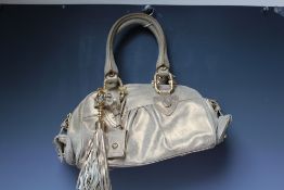 A JUST CAVALLI GOLD LEATHER HANDBAG, two loop handles, with gold-tone detail throughout, tasseled