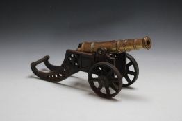 A BRONZE AND CAST IRON MODAL OF A CANON, W 45 cm