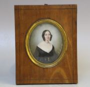 A. HUGE (XIX). An oval portrait miniature on ivory of a young lady in black dress, signed and
