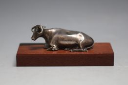 A HALLMARKED SILVER MODEL OF A COW - SHEFFIELD 1836, on later wooden plinth, W 9.5 cm