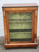 A MID VICTORIAN GLAZED PIER CABINET, the single glazed door opening to a velvet lined interior,
