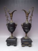 A PAIR OF NEOCLASSICAL STYLE MANTLE URNS / GARNITURES, the metal mounts depicting a mythical bird to