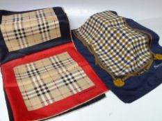 A VINTAGE BURBERRY SCARF, 46 x 46 cm, together with an Aquascutum scarf, 146 x 25 cm (2)