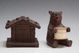 A BLACK FOREST BEAR COTTON REEL HOLDER, together with a chalet inkwell, W 9 cm (2)