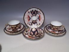 THREE ROYAL CROWN DERBY TRIOS, pattern no. 5683, varying dates to backstamps