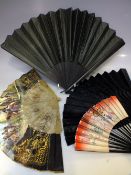 THREE VINTAGE EBONISED FOLDING FANS, together with a lucite example depicting matadors and bull