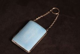 A HALLMARKED SILVER AND GUILLOCHE ENAMEL SHAPED CIGARETTE CASE - BIRMINGHAM 1912, with chain and