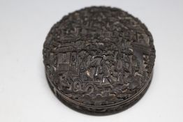 AN ORIENTAL TYPE CARVED TORTOISESHELL PILL BOX, in a Chinese style, Dia 8 cm