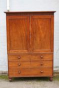 A GEORGIAN MAHOGANY LINEN PRESS, the twin door upper section opening to five fitted linen shelves,