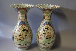 A PAIR OF ORIENTAL BALUSTER VASES WITH FRILLED RIMS, each vase decorated with a figure in a shaped