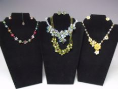 A SELECTION OF BUTLER AND WILSON FASHION JEWELLERY, to include three necklace and earrings sets (4)