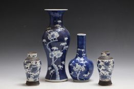 FOUR PIECES OF ORIENTAL CHINA, consisting of a small pair of baluster vases, a specimen 'Prunus'