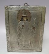 (XIX). A religious icon on panel with exposed head and hands and white metal oklad with acrylic