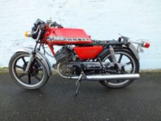 A 1982 YAMAHA RD200 MOTORCYCLE 'BWD 354Y', having red coachwork and chrome mudguards, partially