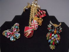 A BUTLER AND WILSON 40TH ANNIVERSARY COMMEMORATIVE KEYRING, together with a gemset owl brooch and