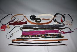 A COLLECTION OF VINTAGE AND FASHION BELTS, various styles and periods, to include fabric and leather