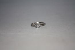 A PLATINUM DIAMOND SOLITAIRE RING, the brilliant cut diamond being of an estimated half a carat,