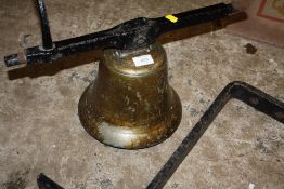 A LARGE VINTAGE WALL HANGING BELL WITH CAST METAL BRACKET