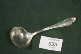 A HALLMARKED SILVER SIFTER SPOON