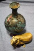 AN ORIENTAL BRASS FIGURE OF A RAT WITH A BAG TOGETHER WITH AN ORIENTAL METAL VASE WITH CHARACTER