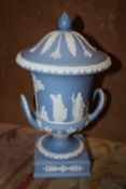 A WEDGWOOD BLUE JASPERWARE TWIN HANDLED CAMPANA LIDDED URN