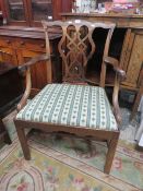 A LARGE OPEN CHIPPENDALE MAHOGANY ARMCHAIR A/F ( BACK IS BROKEN AND ATTACHED )