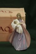 A BOXED NAO PRIMERA MATERNIDAD FIGURE OF A WOMAN WITH A BABY