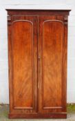 A 19TH CENTURY TWIN DOOR WARDROBE OF SMALL PROPORTIONS, the twin doors opening ti a hanging rail and