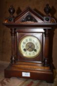 A VINTAGE MAHOGANY MANTEL CLOCK