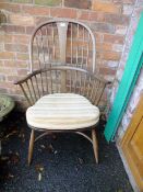 AN ERCOL LARGE HOOP BACK WINDSOR ARMCHAIR