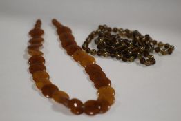 A VINTAGE LADIES AMBER STYLE NECKLACE, TOGETHER WITH ANOTHER (2)