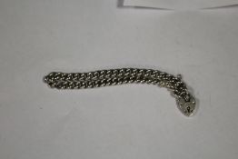 A HALLMARKED SILVER CURB LINK BRACELET