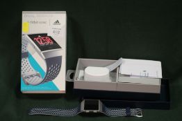 A BOXED ADIDAS FITBIT IONIC