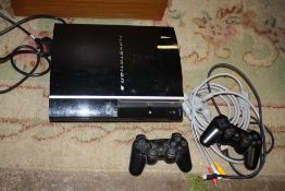 A PS3 CONSOLE AND CONTROLLERS