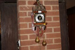 A REPRODUCTION MAHOGANY WALL CLOCK WITH WEIGHTS