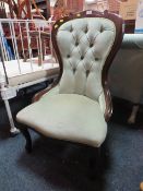 A MODERN UPHOLSTERED BEDROOM CHAIR