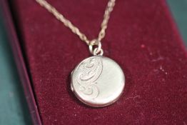 A LADIES 9CT BK&FT LOCKET